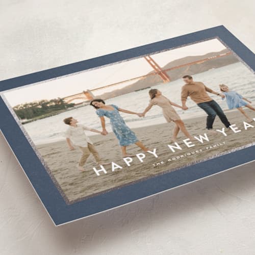 This is a navy foil pressed holiday cards with foil pressed by Wildfield Paper Co called skyline printing on recycled smooth signature in standard