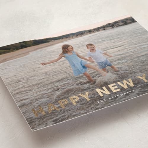 This is a linen foil pressed holiday cards with foil pressed by Angela Thompson called gilded printing on recycled smooth signature in standard