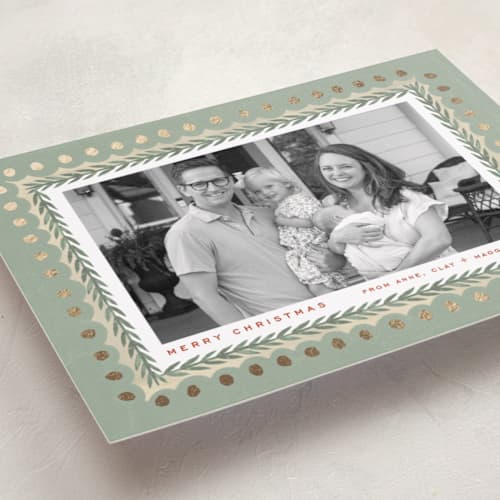 This is a sage foil pressed holiday cards with foil pressed by Amy Kross called primary printing on recycled smooth signature in standard