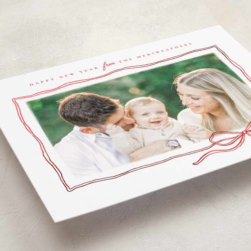 This is a ribbon foil pressed holiday cards with foil pressed by Wildfield Paper Co called bow sketch printing on recycled smooth signature in standard