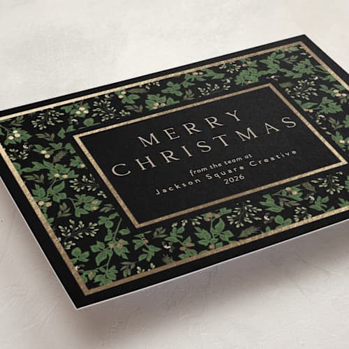 This is a pine business holiday cards with foil pressed by Susan Moyal called happy holiday printing on signature in standard