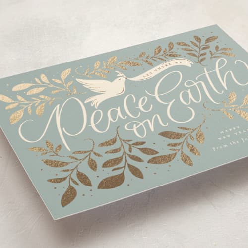 This is a blue spruce foil pressed holiday cards with foil pressed by Erin German called botanical peace on earth printing on signature in standard