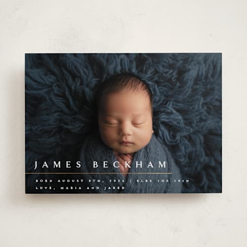 This is a snowfall foil stamped birth announcements with foil pressed by Melanie Kosuge called minimalist printing on recycled smooth signature in standard