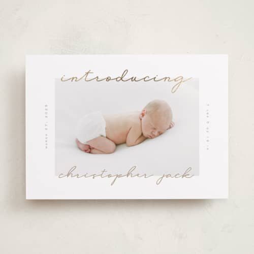 This is a powder foil stamped birth announcements with foil pressed by Creo Study called border script printing on recycled smooth signature in standard