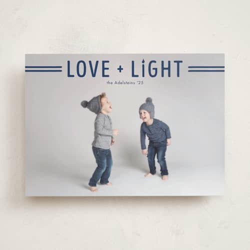 This is a navy hanukkah cards with standard by Jen Banks called love + light printing on recycled smooth signature in standard