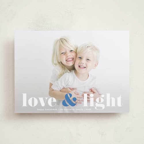 This is a denim hanukkah cards with standard by Kerry Doyle called love & light type printing on recycled smooth signature in standard