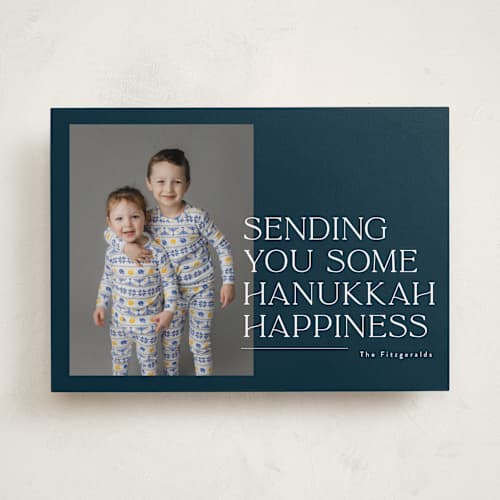 This is a navy hanukkah cards with standard by Jackie Crawford called sending holiday happiness printing on recycled smooth signature in standard