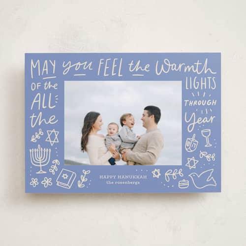 This is a robin blue hanukkah cards with standard by Abbigail Lim called warmth of the lights printing on recycled smooth signature in standard
