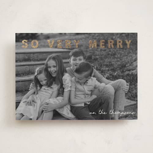 This is a cream foil pressed holiday cards with foil pressed by Jenny Millington called merry greeting printing on recycled smooth signature in standard