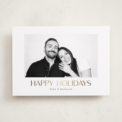 This is a snow foil pressed holiday cards with foil pressed by Kristen Knechtel called minimalist holiday printing on recycled smooth signature in standard
