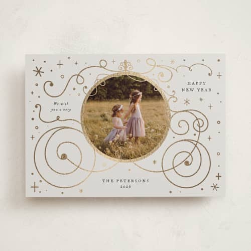 This is a ivory foil pressed holiday cards with foil pressed by Amy Payne called disney's cinderella carriage printing on recycled smooth signature in standard