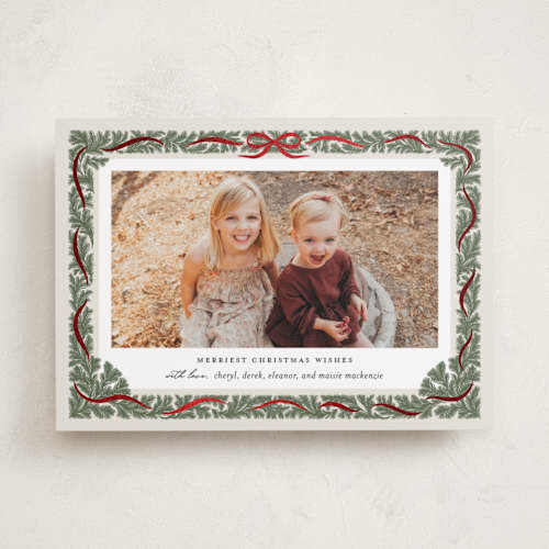 This is a pine foil pressed holiday cards with foil pressed by Paper Raven Co. called merriest ribbon printing on recycled smooth signature in standard