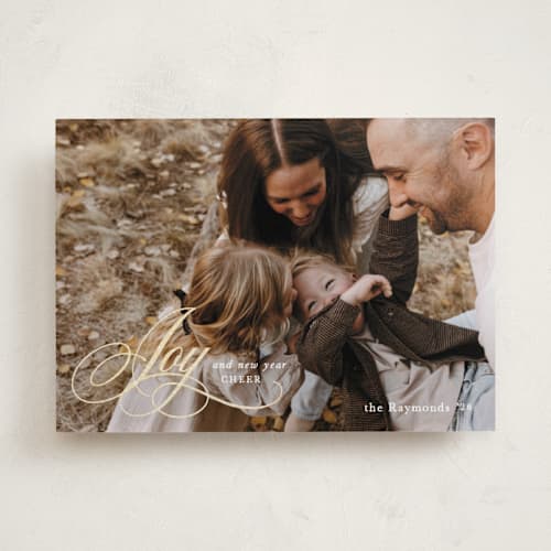 This is a snow foil pressed holiday cards with foil pressed by Mansi Verma called gold scripted joy printing on recycled smooth signature in standard