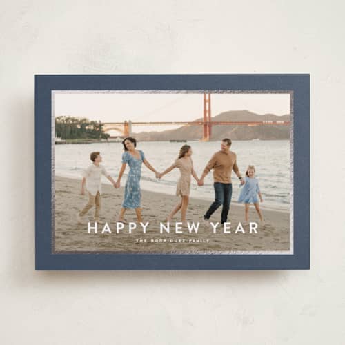 This is a navy foil pressed holiday cards with foil pressed by Wildfield Paper Co called skyline printing on recycled smooth signature in standard
