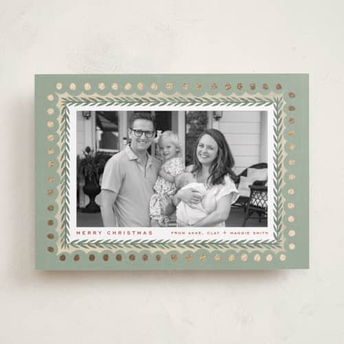 This is a sage foil pressed holiday cards with foil pressed by Amy Kross called primary printing on recycled smooth signature in standard