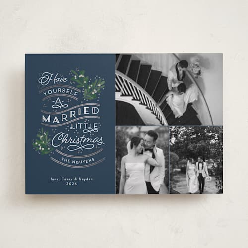 This is a navy foil pressed holiday cards with foil pressed by Sarah Brown called a little married printing on recycled smooth signature in standard