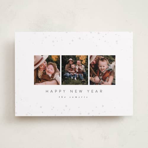 This is a snowy gloss press holiday cards with gloss press by Carolyn Nicks called confetti stars printing on recycled smooth signature in standard