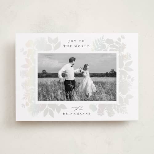 This is a snow gloss press holiday cards with gloss press by Brooke Chandler called joy greenery printing on recycled smooth signature in standard