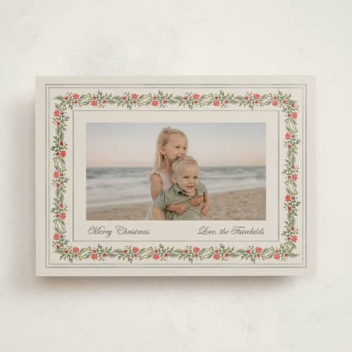 This is a vanilla holiday photo cards with standard by lori jacobs wemple called merry frame greenery printing on recycled smooth signature in standard