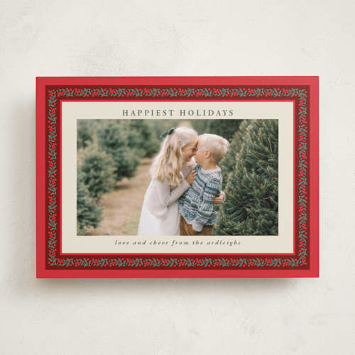 This is a holly berry holiday photo cards with standard by Kristie Kern called revelry printing on recycled smooth signature in standard