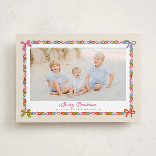 This is a buttercream holiday photo cards with standard by Erika Firm called paperchain border printing on recycled smooth signature in standard