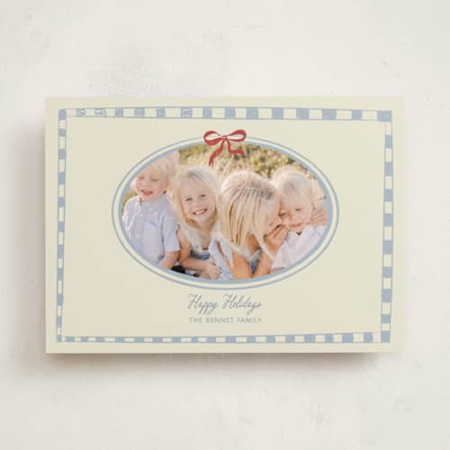 This is a celestial holiday photo cards with standard by Helena Vitto called little bow printing on recycled smooth signature in standard