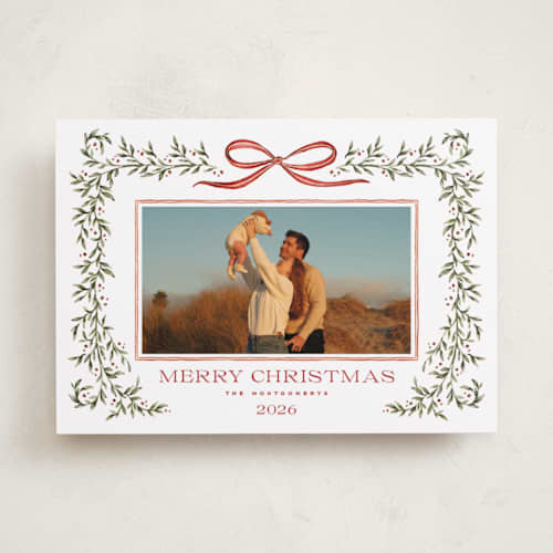 This is a holly berry holiday photo cards with standard by Wildfield Paper Co called laurel wreath printing on recycled smooth signature in standard
