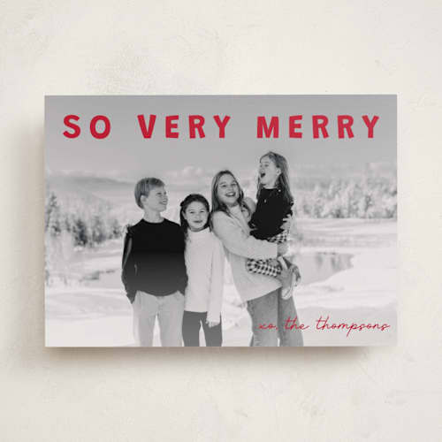 This is a holly holiday photo cards with standard by Jenny Millington called merry greeting printing on recycled smooth signature in standard