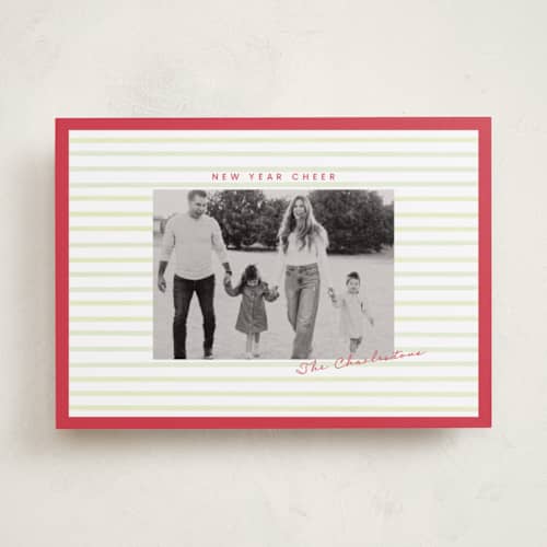This is a holly holiday photo cards with standard by Poised Avenue called framed in stripes printing on recycled smooth signature in standard