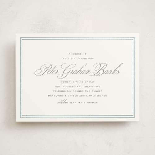 This is a cement foil stamped birth announcements with foil pressed by Megan Davis called scholarly charm printing on signature in standard