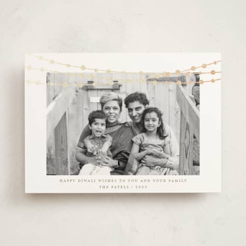 This is a champagne diwali cards with foil pressed by Kate Ross called under lights printing on signature in standard