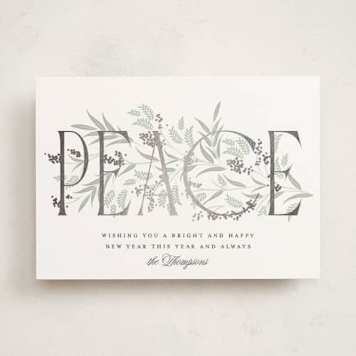 This is a snow foil pressed holiday cards with foil pressed by Robert and Stella called entwined peace printing on signature in standard