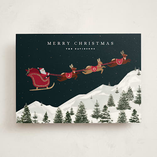 This is a poinsettia foil pressed holiday cards with foil pressed by Jennifer Lew called christmas eve printing on signature in standard