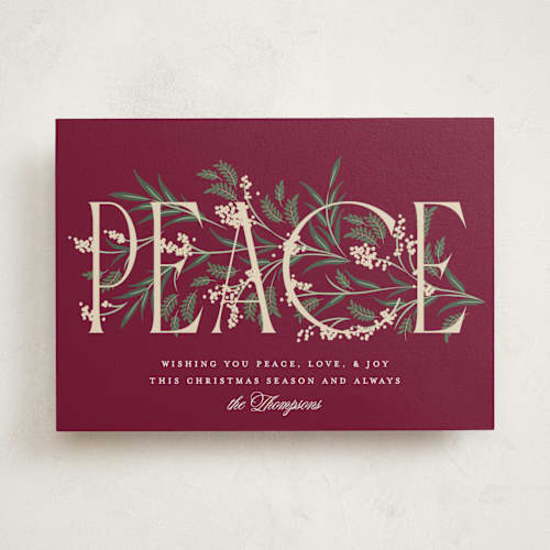 This is a holly berry non photo holiday cards with standard by Robert and Stella called entwined peace printing on signature in standard