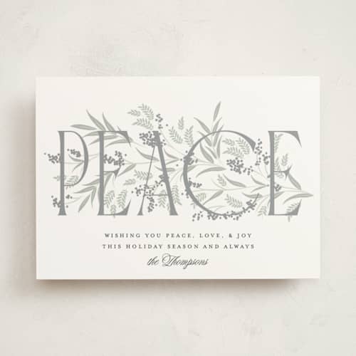 This is a snow non photo holiday cards with standard by Robert and Stella called entwined peace printing on signature in standard