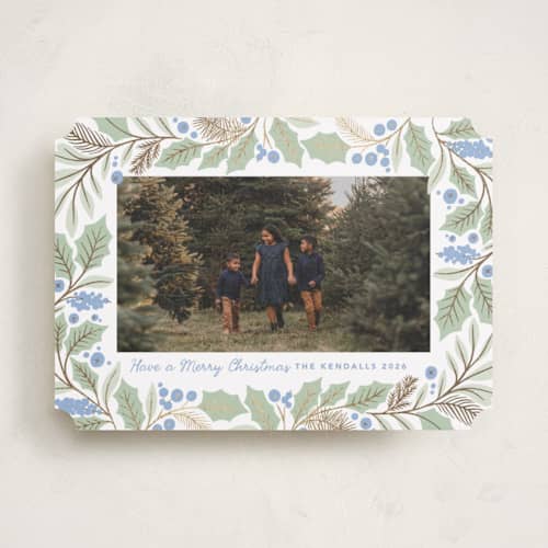 This is a bluebelle foil pressed holiday cards with foil pressed by Kristen Smith called gilded holly border printing on recycled smooth signature in standard