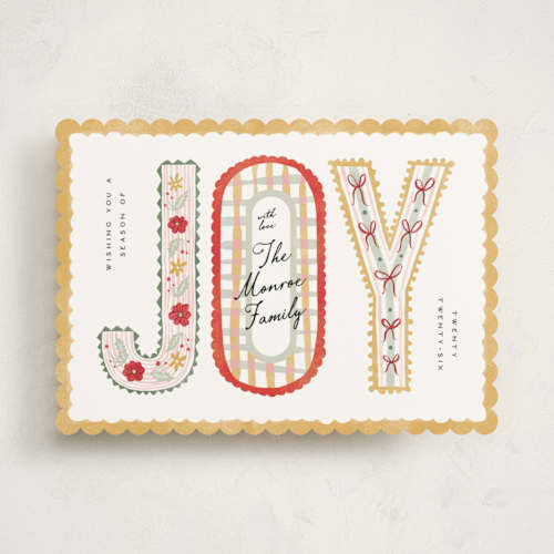 This is a butter non photo holiday cards with standard by Pixel and Hank called joy ribbon printing on signature in standard