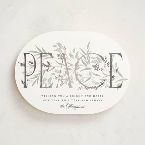 This is a snow foil pressed holiday cards with foil pressed by Robert and Stella called entwined peace printing on signature in standard