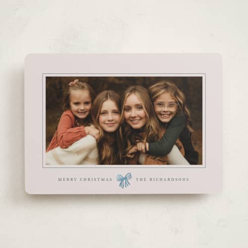 This is a celestial foil pressed holiday cards with foil pressed by Olivia Kanaley Inman called little striped bow printing on recycled smooth signature in standard