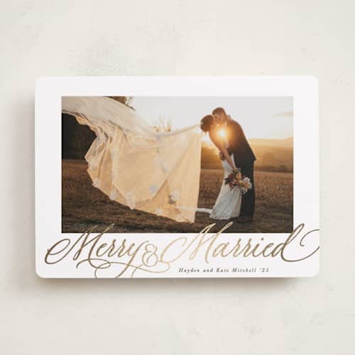 This is a cinnamon foil pressed holiday cards with foil pressed by Hooray Creative called elegantly married printing on recycled smooth signature in standard