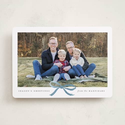 This is a mist foil pressed holiday cards with foil pressed by Olivia Kanaley Inman called crimson bow printing on recycled smooth signature in standard