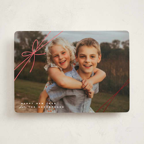 This is a birch foil pressed holiday cards with foil pressed by Leia Matt called tied with joy printing on recycled smooth signature in standard