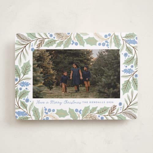 This is a bluebelle foil pressed holiday cards with foil pressed by Kristen Smith called gilded holly border printing on recycled smooth signature in standard