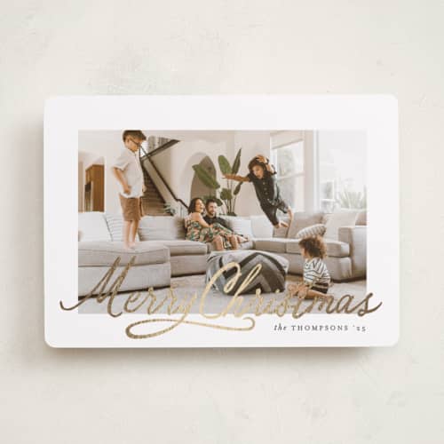 This is a snowdrift foil pressed holiday cards with foil pressed by Karidy Walker called classic christmas script printing on recycled smooth signature in standard