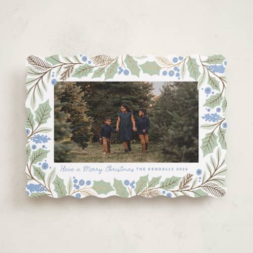 This is a bluebelle foil pressed holiday cards with foil pressed by Kristen Smith called gilded holly border printing on recycled smooth signature in standard