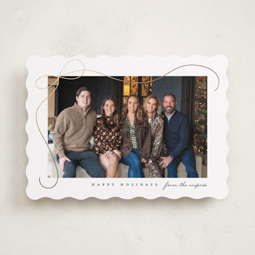 This is a snow foil pressed holiday cards with foil pressed by Lauren Chism called cascading bow printing on recycled smooth signature in standard