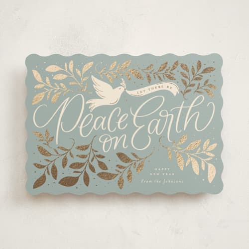 This is a blue spruce foil pressed holiday cards with foil pressed by Erin German called botanical peace on earth printing on signature in standard