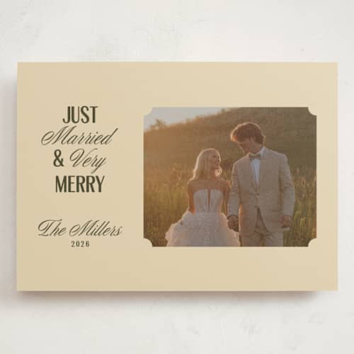 This is a ivory holiday photo cards with standard by Ana de Sousa called just married & merry printing on signature in grand