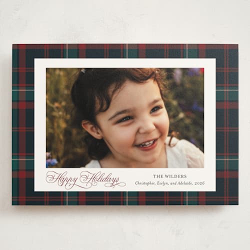 This is a navy holiday photo cards with standard by Cindy Reynolds called plaid traditions printing on signature in grand