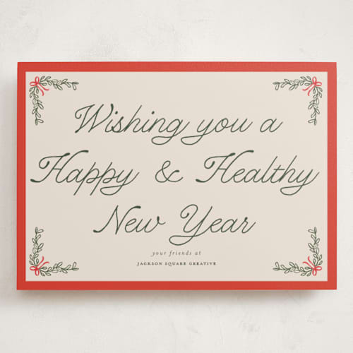 This is a cherry glaze holiday photo cards with standard by Morgan Kendall called garland printing on signature in grand